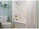 Bathroom featuring a tub/shower with white subway tile, and brass hardware at 10744 Eldorado Cir, Noblesville, IN 46060