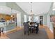 This dining room features a modern light fixture, hardwood floors and opens up to the kitchen for easy access at 10744 Eldorado Cir, Noblesville, IN 46060