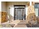 Inviting front entryway features stone accents and a welcoming dark door at 10744 Eldorado Cir, Noblesville, IN 46060