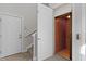Hallway with a door to the elevator and another door to a staircase at 10744 Eldorado Cir, Noblesville, IN 46060