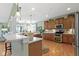 This kitchen features stainless steel appliances, an eat in bar, recessed lighting, and a great open concept at 10744 Eldorado Cir, Noblesville, IN 46060