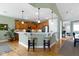 The kitchen features stainless steel appliances, hardwood floors, an eat in bar, and plenty of cabinets at 10744 Eldorado Cir, Noblesville, IN 46060