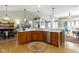 This kitchen features stainless steel appliances, hardwood floors, an eat in bar, and recessed lighting at 10744 Eldorado Cir, Noblesville, IN 46060