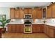 Gourmet kitchen boasts custom cabinets, stainless steel appliances, and a stylish backsplash for a modern design at 10744 Eldorado Cir, Noblesville, IN 46060