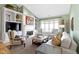 The living room has neutral paint, a fireplace, built in shelving, recessed lighting, and large windows at 10744 Eldorado Cir, Noblesville, IN 46060