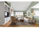 The living room has neutral paint, a fireplace, built in shelving, recessed lighting, and large windows at 10744 Eldorado Cir, Noblesville, IN 46060