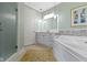 The main bathroom features a soaking tub with tile surround, a glass shower and a double sink vanity at 10744 Eldorado Cir, Noblesville, IN 46060