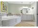 The main bathroom features a soaking tub with tile surround and a double sink vanity at 10744 Eldorado Cir, Noblesville, IN 46060