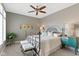 Cozy main bedroom with a metal bed frame, ceiling fan, neutral walls and carpet flooring at 10744 Eldorado Cir, Noblesville, IN 46060