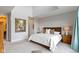 Comfortable main bedroom featuring a brown headboard, white bedding, carpet floor, and neutral walls at 10744 Eldorado Cir, Noblesville, IN 46060