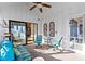Bright and airy sunroom with comfortable seating and sliding glass doors leading to the outdoors at 10744 Eldorado Cir, Noblesville, IN 46060