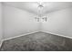 Cozy bedroom with a large window, soft carpet, and a ceiling light at 110 Pleasant Run Dr, Markleville, IN 46056