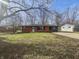 Attractive home with a brick exterior, tidy lawn, and mature trees at 110 Pleasant Run Dr, Markleville, IN 46056