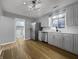 Well-lit kitchen featuring stainless steel appliances, white cabinetry, and modern lighting at 110 Pleasant Run Dr, Markleville, IN 46056