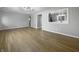 Spacious living room featuring wood floors, light walls, and modern lighting at 110 Pleasant Run Dr, Markleville, IN 46056