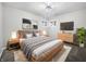 Comfortable main bedroom with a queen bed, bedside tables, and soft lighting at 110 Pleasant Run Dr, Markleville, IN 46056