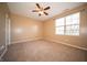 Bedroom with neutral carpet, ceiling fan and a large window with natural light at 123 Bridgemor Ln, Mooresville, IN 46158