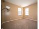 A simple bedroom with two windows, neutral carpet, and a lamp at 123 Bridgemor Ln, Mooresville, IN 46158