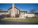 Charming exterior view of a well-maintained home featuring stone accents, arched windows, and a manicured lawn at 123 Bridgemor Ln, Mooresville, IN 46158