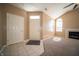 Spacious living room featuring tiled entryway, vaulted ceilings, a fireplace, and large, arched windows at 123 Bridgemor Ln, Mooresville, IN 46158