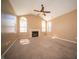 Bright living room featuring a fireplace, neutral carpeting, and vaulted ceilings, with ample natural light at 123 Bridgemor Ln, Mooresville, IN 46158