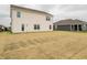 Backyard view of a home featuring a large yard with freshly seeded lawn at 1265 Fleming Dr, Greenfield, IN 46140