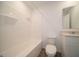 Clean bathroom with white fixtures, including vanity, toilet, and shower-tub combination at 1265 Fleming Dr, Greenfield, IN 46140