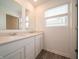 Bathroom with a double sink vanity, stone countertops, and wood look flooring at 1265 Fleming Dr, Greenfield, IN 46140