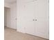 Bedroom featuring fresh carpeting and neutral paint with multiple doors and closets at 1265 Fleming Dr, Greenfield, IN 46140