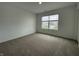 Bright bedroom featuring neutral carpet and one large window with a neighborhood view at 1265 Fleming Dr, Greenfield, IN 46140