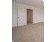 Bedroom featuring neutral carpet and a door, offering a glimpse into other rooms at 1265 Fleming Dr, Greenfield, IN 46140