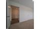 Bedroom featuring plush carpet, neutral walls, and a doorway with multiple rooms at 1265 Fleming Dr, Greenfield, IN 46140
