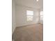 Bright bedroom with neutral carpet and large windows, filling the space with natural light at 1265 Fleming Dr, Greenfield, IN 46140
