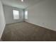 Neutral bedroom with carpeted floor and two windows that bring in natural light at 1265 Fleming Dr, Greenfield, IN 46140