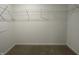 Walk-in closet featuring neutral carpeting and wire shelving for optimal storage organization at 1265 Fleming Dr, Greenfield, IN 46140