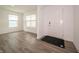 Bright entryway featuring hardwood floors, a white door, and natural light from the windows at 1265 Fleming Dr, Greenfield, IN 46140