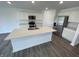 Modern kitchen featuring white cabinets, stainless steel appliances, and a spacious island with a sink at 1265 Fleming Dr, Greenfield, IN 46140