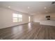 Open concept living room with hardwood floors, recessed lighting, and access to the kitchen at 1265 Fleming Dr, Greenfield, IN 46140