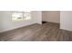 Living room with hardwood floors and a large window providing ample natural light at 1265 Fleming Dr, Greenfield, IN 46140