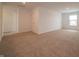 Open living room with neutral carpet, providing flexible living space with natural light at 1265 Fleming Dr, Greenfield, IN 46140