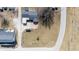 Birds eye view of neighborhood and property showing the back yard, driveway, and nearby cemetery at 1303 S D St, Elwood, IN 46036