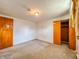 Spacious bedroom features a light fixture, closet, and neutral walls at 1303 S D St, Elwood, IN 46036