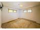 A bedroom with carpet, windows, and mounted television bracket at 1303 S D St, Elwood, IN 46036