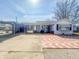Charming single-story home with an inviting front entrance and carport at 1303 S D St, Elwood, IN 46036