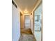 A hallway that leads into a living area with a partially visible kitchen on the right at 1303 S D St, Elwood, IN 46036