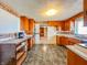Spacious kitchen with dated cabinets, and an open layout at 1303 S D St, Elwood, IN 46036