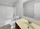 A full bathroom includes a vanity and a shower-tub combination at 15503 Sandlands Cir, Noblesville, IN 46060