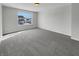 A carpeted bedroom has a window with views of the outdoors at 15503 Sandlands Cir, Noblesville, IN 46060
