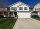 Charming two-story home with a wide driveway and attached two-car garage at 15503 Sandlands Cir, Noblesville, IN 46060
