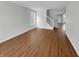 A bright living room features hardwood floors and a staircase leading to the upper level at 15503 Sandlands Cir, Noblesville, IN 46060